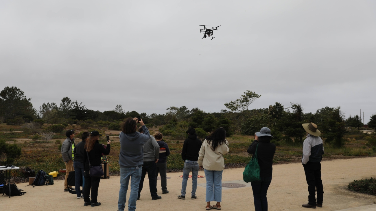 Students at CSUMB flying a drone outdoors
